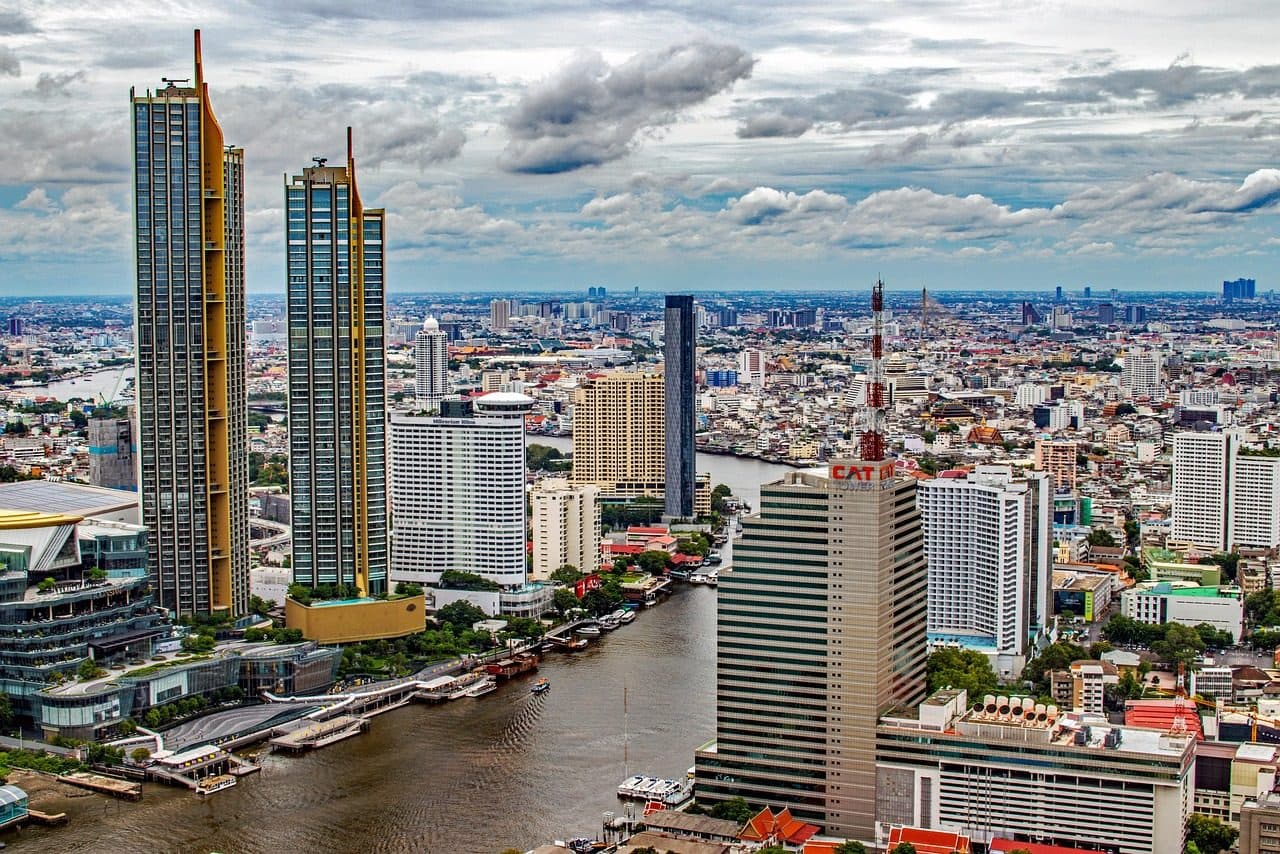 Bangkok's skyscrapers rising beside a bend of the Chao Phraya
