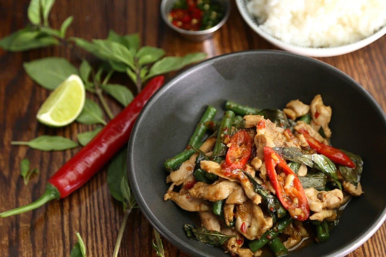 A bowl of chicken stir-fried with holy basil and red chillies